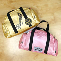 Pink Pineapple Dance Bag and Gold Pineapple Dance bag with Pineapple branding.